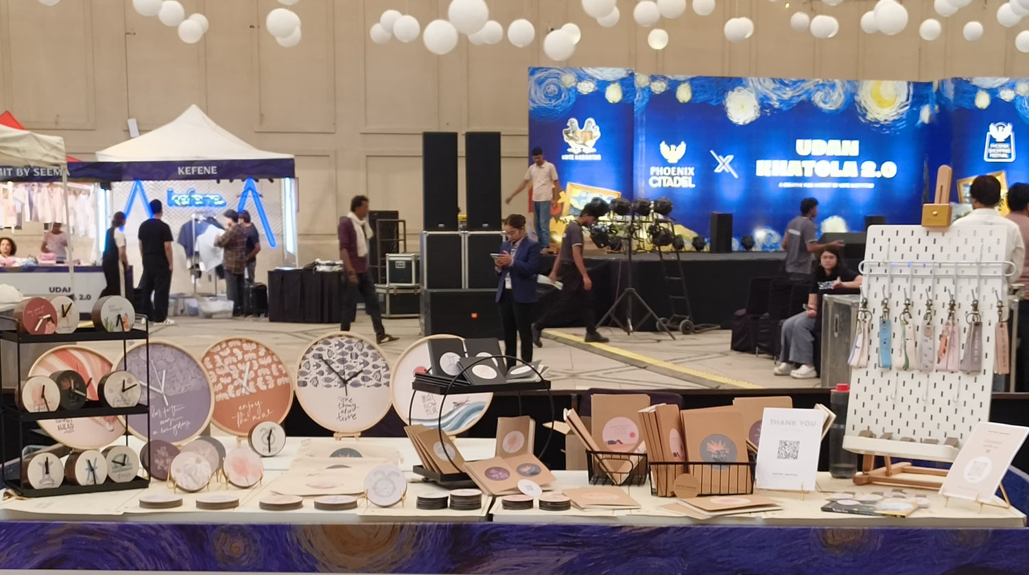 UDAN Khatola 2.0 booth at a shopping festival with various products on display.